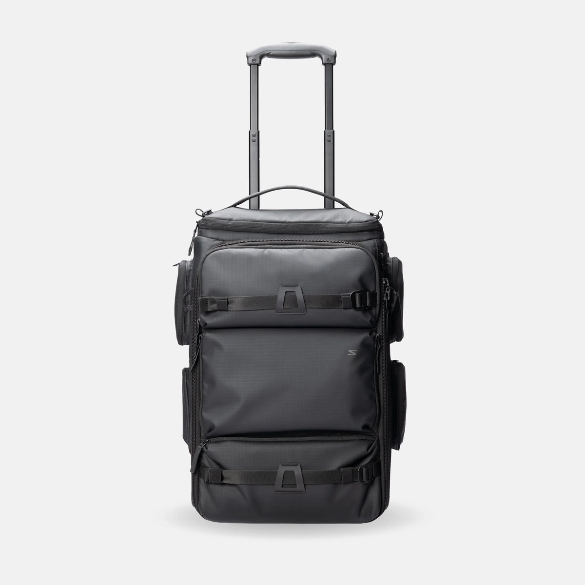 A black rolling duffel bag with an extended telescoping handle, shown against a light gray studio background.