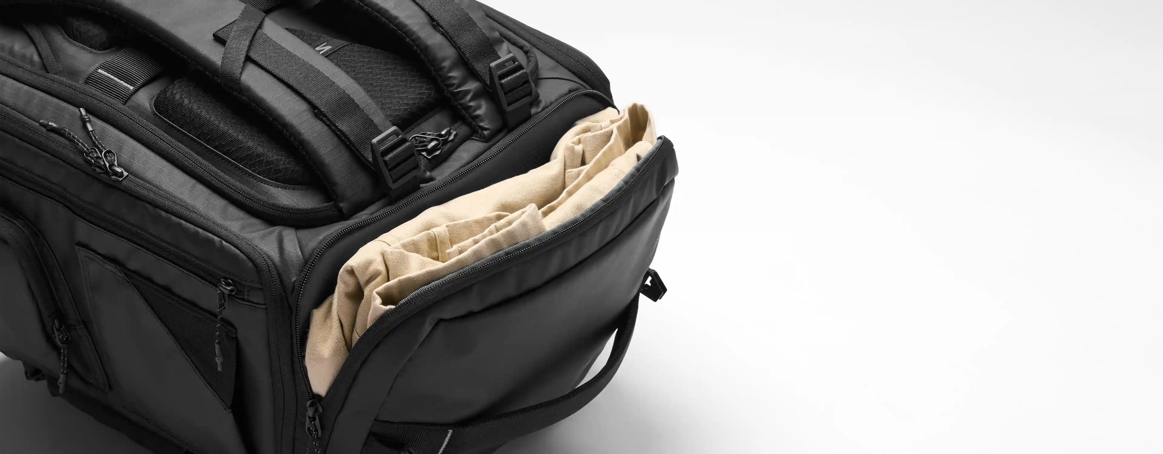 Black backpack with beige interior on a white background