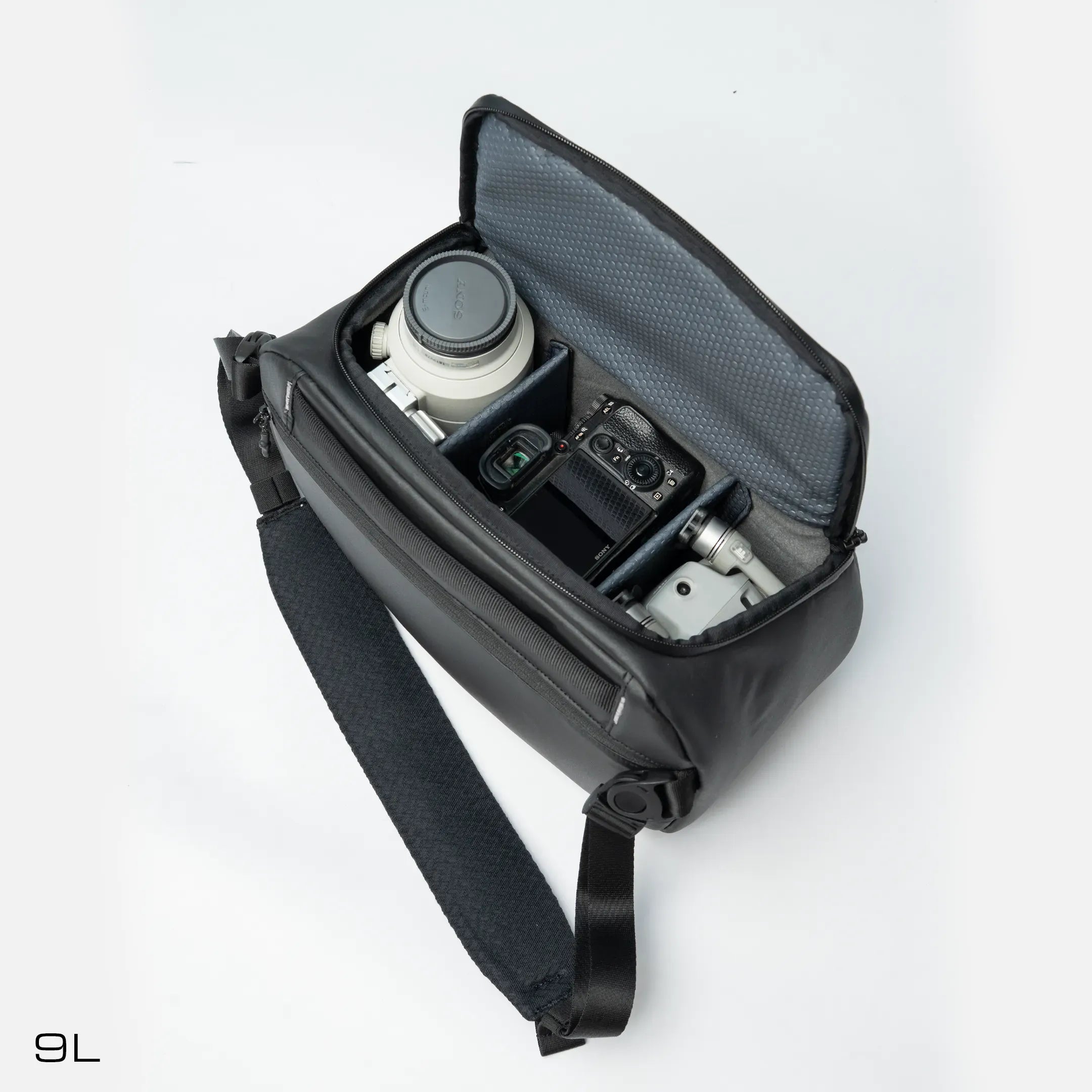Compact 9L camera sling with waterproof design and padded compartments.