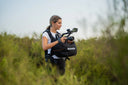 female videographer holding camera