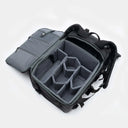 Black backpack with open compartment on a white background