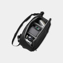 Black camera bag with a camera inside on a light gray background