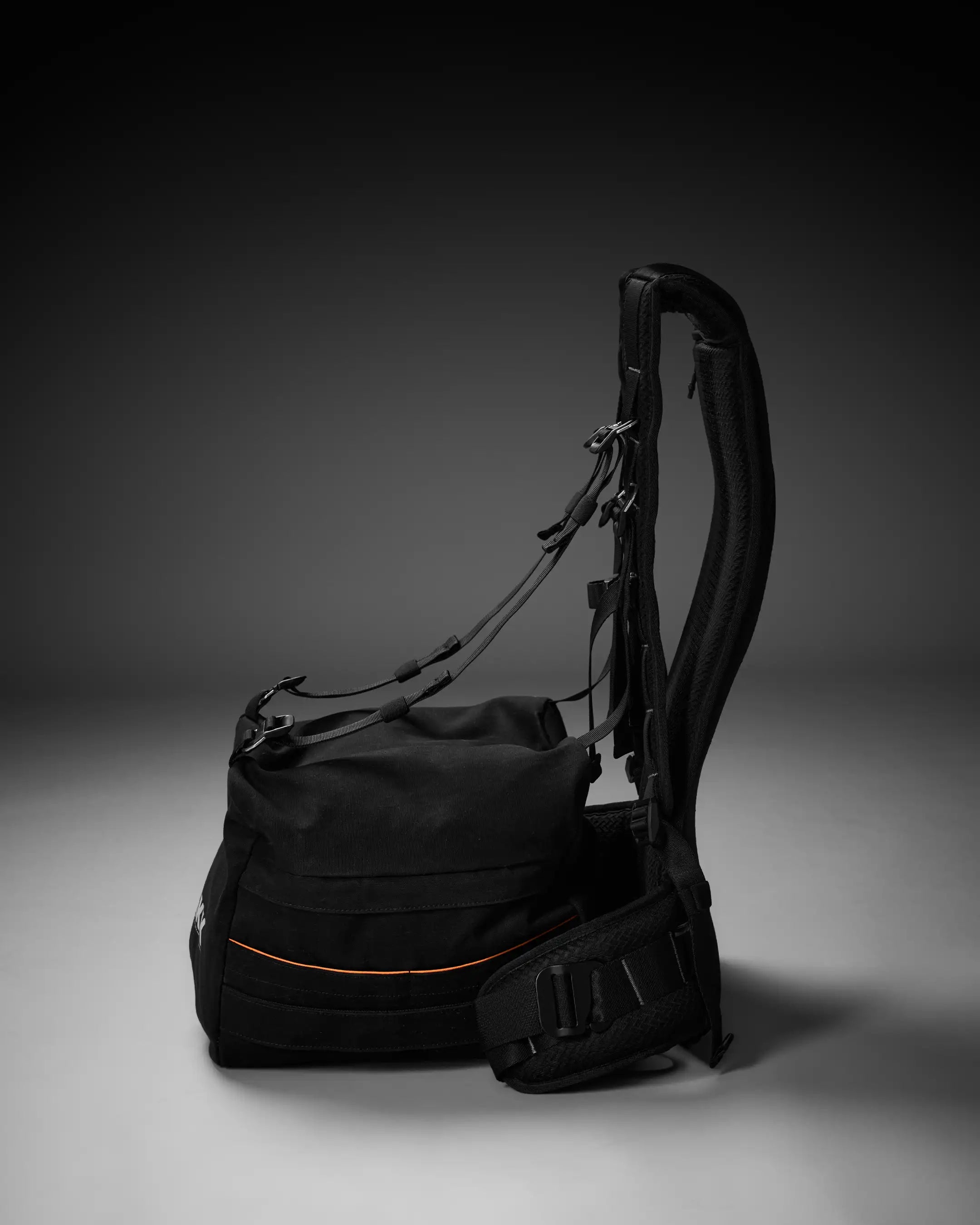 Black backpack on a gray background
