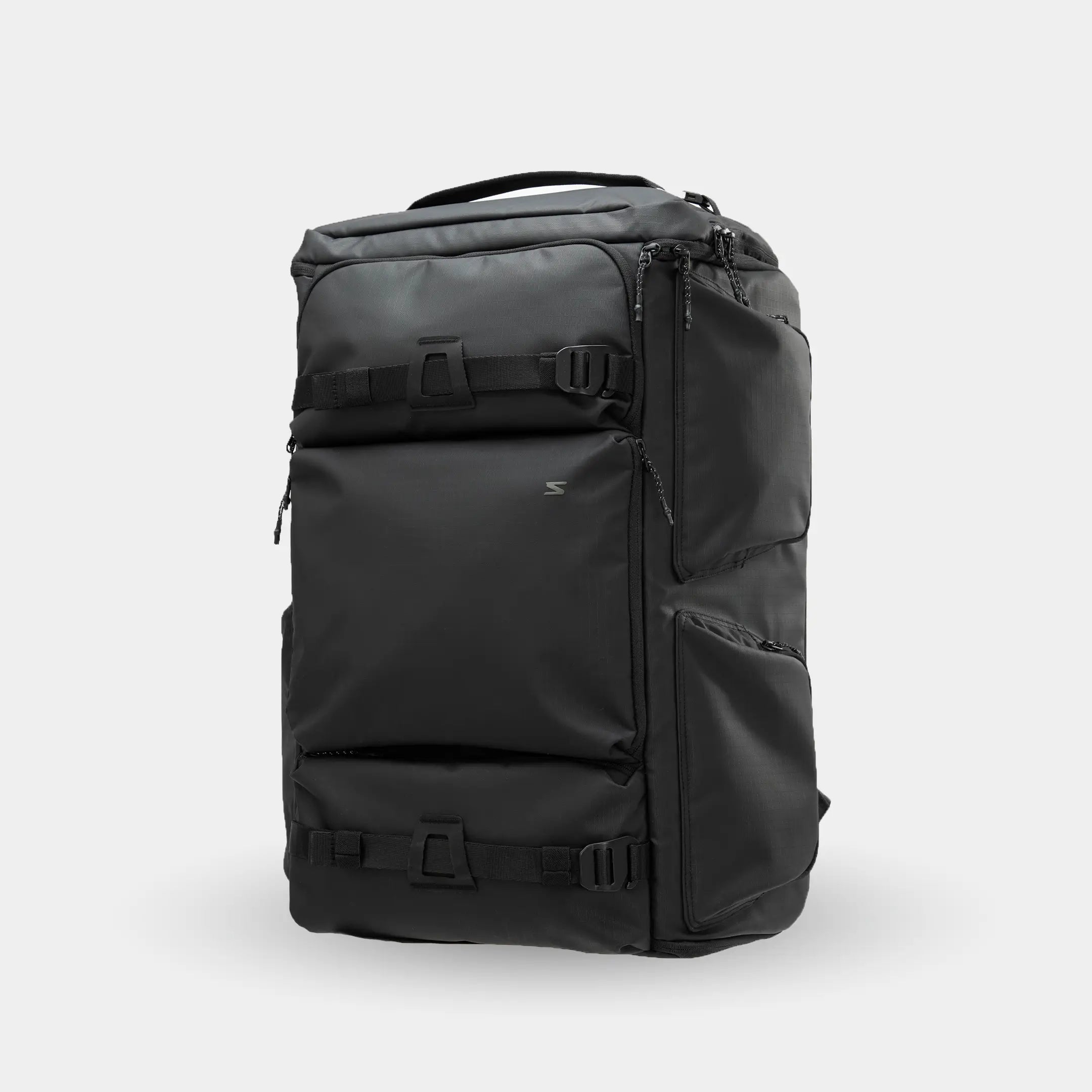 Black backpack on a light gray background