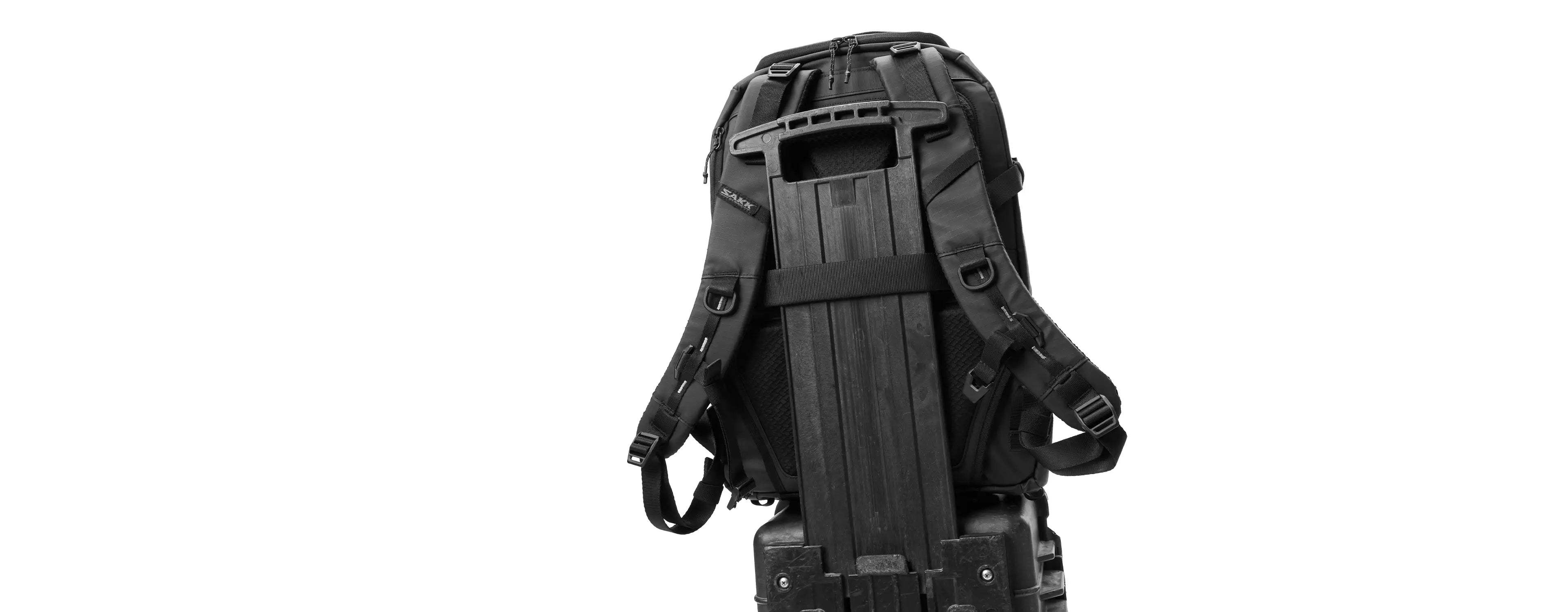 Black tactical backpack on a white background