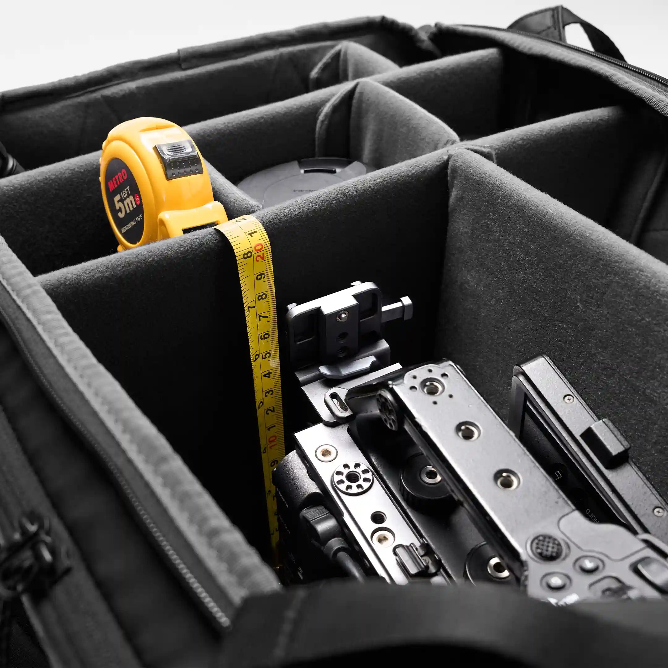tape measure showing depth of a camera bag