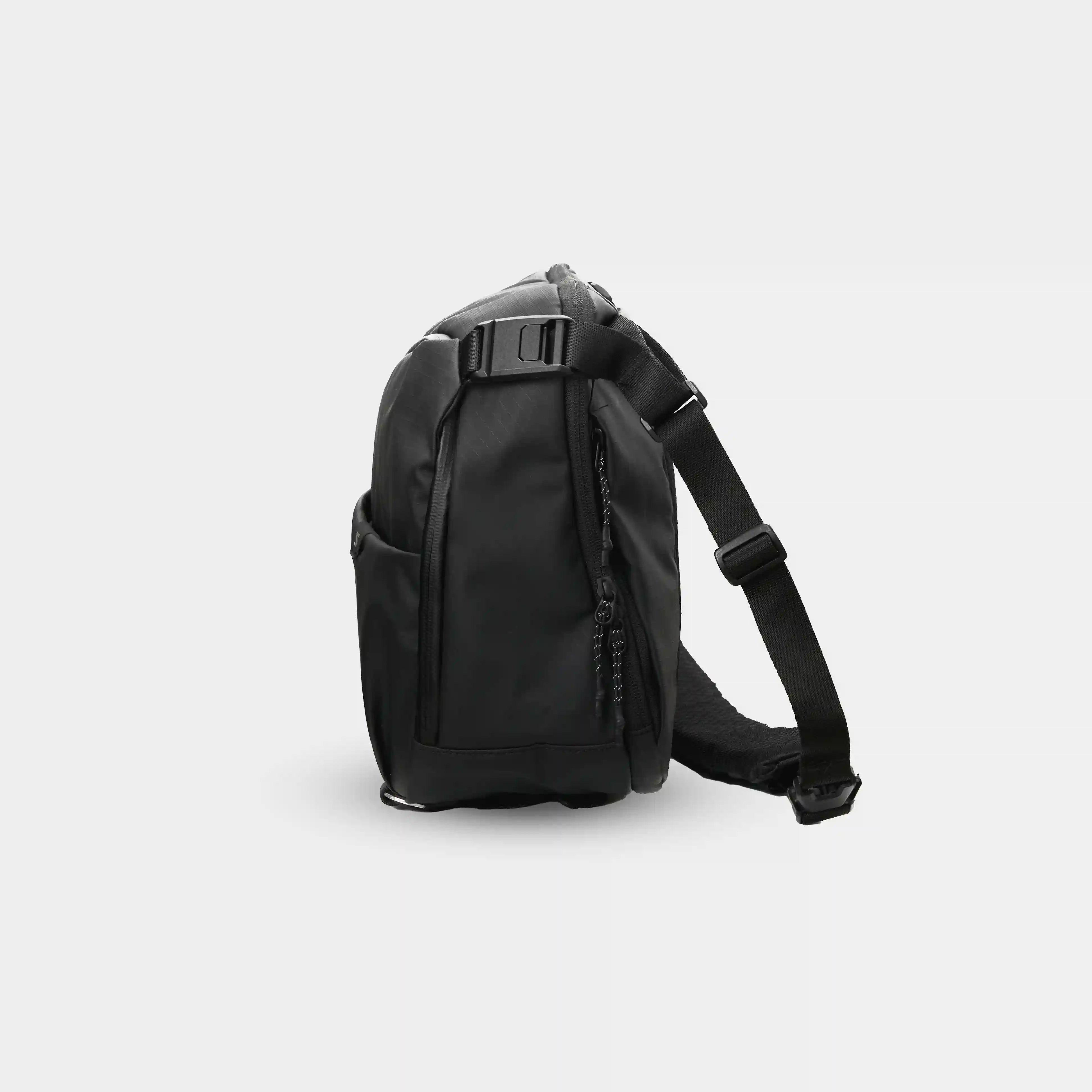 Black backpack on a light gray background