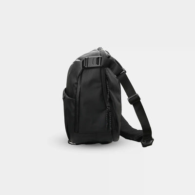 Black backpack on a light gray background