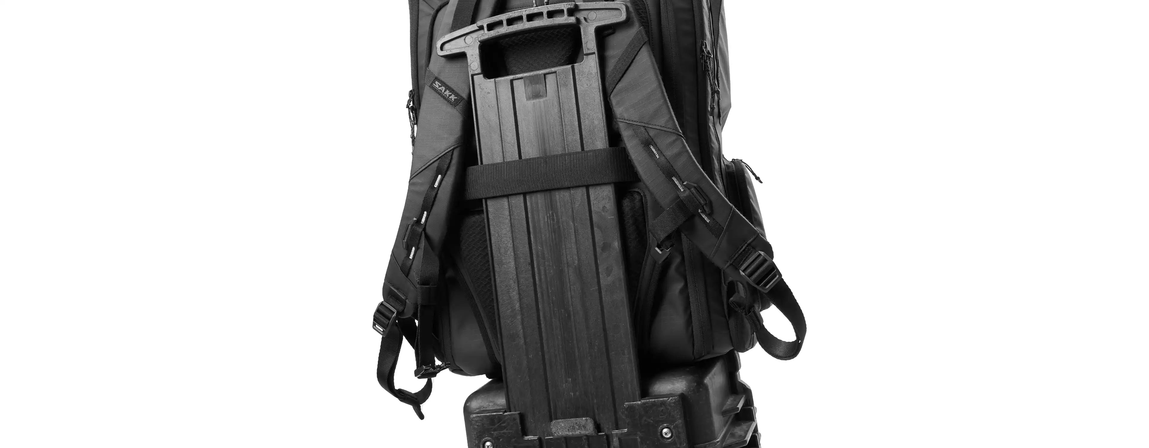 Black tactical backpack with a gun on a white background