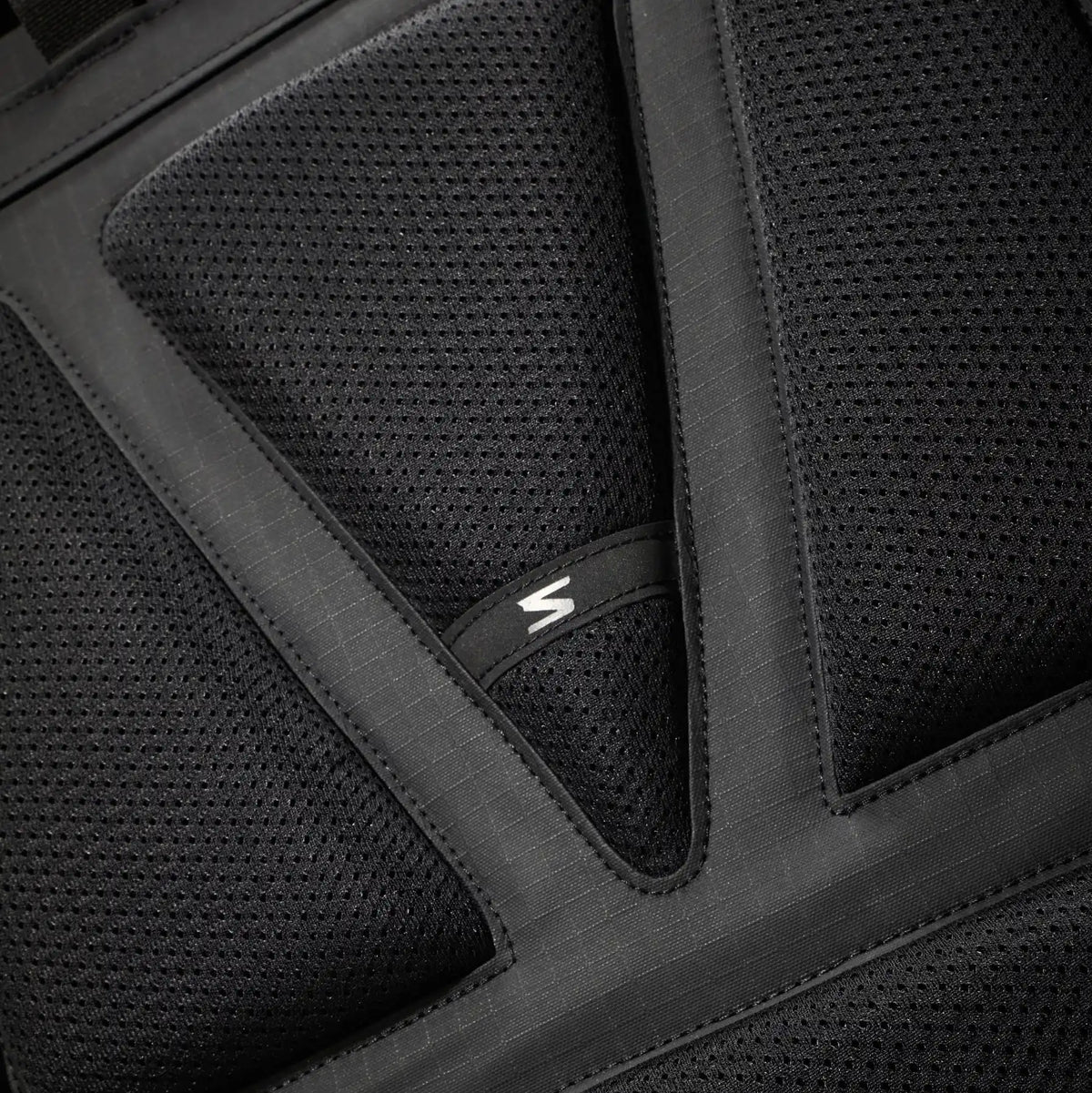 Close-up of the soft mesh material on a backpack, designed for added comfort and breathability.