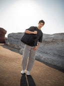 All-black waterproof tote for photographers and creatives. Converts from work to weekend mode.