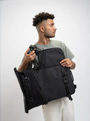 Rolltop backpack with side camera pocket. Fits DSLR or mirrorless camera, lenses, and daily tech.