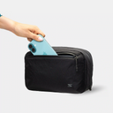 Compact tech pouch with front pocket and main compartment for organized storage.