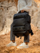 Reinforced nylon handle for overhead grabbing. Durable for airport-to-set transitions.