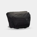 All-black sling bag for camera, laptop, and travel gear