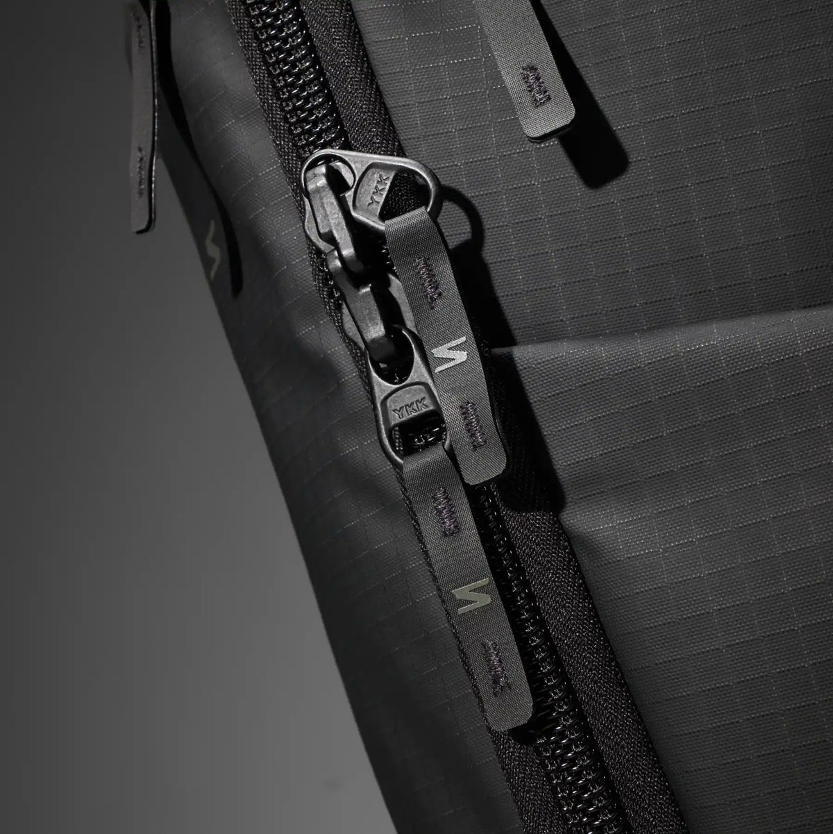 Close-up of zippers of a bag, designed for reliable use and easy access to your gear.