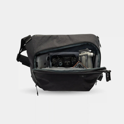 Lightweight sling bag for camera and laptop. Multiple compartments keep tech gear organized and secure.