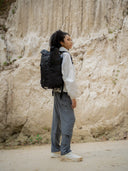 Outdoor adventure backpack with 25L capacity. Rolltop expandable design and multiple pockets for hiking essentials.