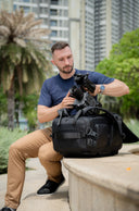 Multi-zone storage with zipped pockets and tech pouch compatibility for efficient packing.