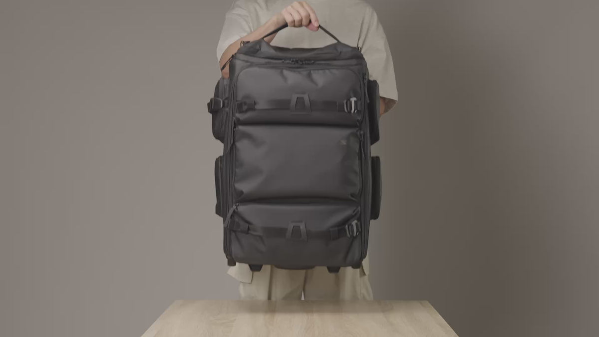 Load video: Video showcasing the Cine Pro Carry-On Roller for camera gear, highlighting its spacious interior, organized storage compartments, and rolling design for transporting cameras, lenses, and filming equipment while traveling.