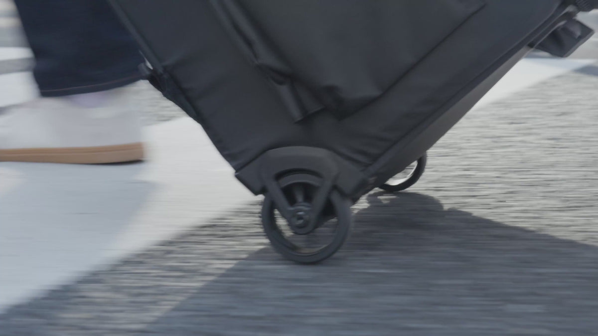 Load video: Video showcasing the camera roller bag, including its storage features, rolling design, and option to carry it as a backpack for easier travel.