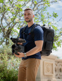 Durable camera backpack with multiple compartments. Fits DSLR, mirrorless cameras, lenses, and accessories for full-day shoots.
