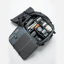 Rolltop backpack with multiple compartments for organized storage.