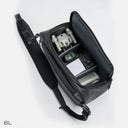 Sling bag with compact drone compartment and padded protection.
