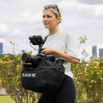 Soft camera saddle that reduces shake during handheld or surface-mounted shots.