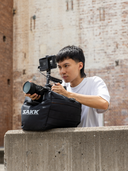 Water-resistant exterior with soft fill—protects gear while securing your shot.
