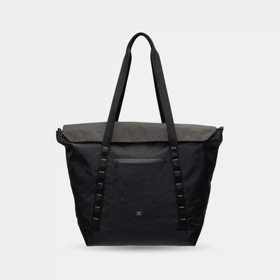 Waterproof tote bag with laptop compartment, internal pockets, and grab-and-go back pocket.